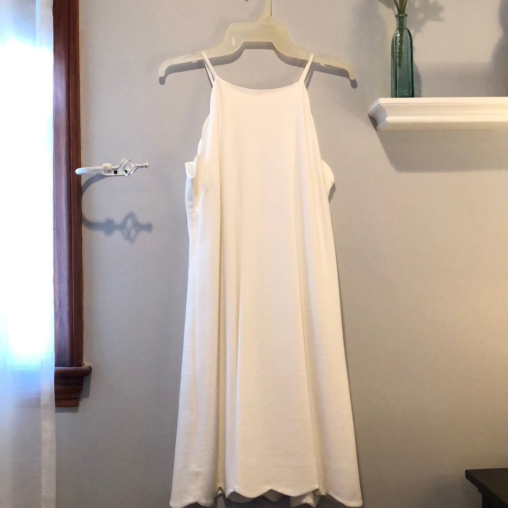 White swing dress with scalloped edges
